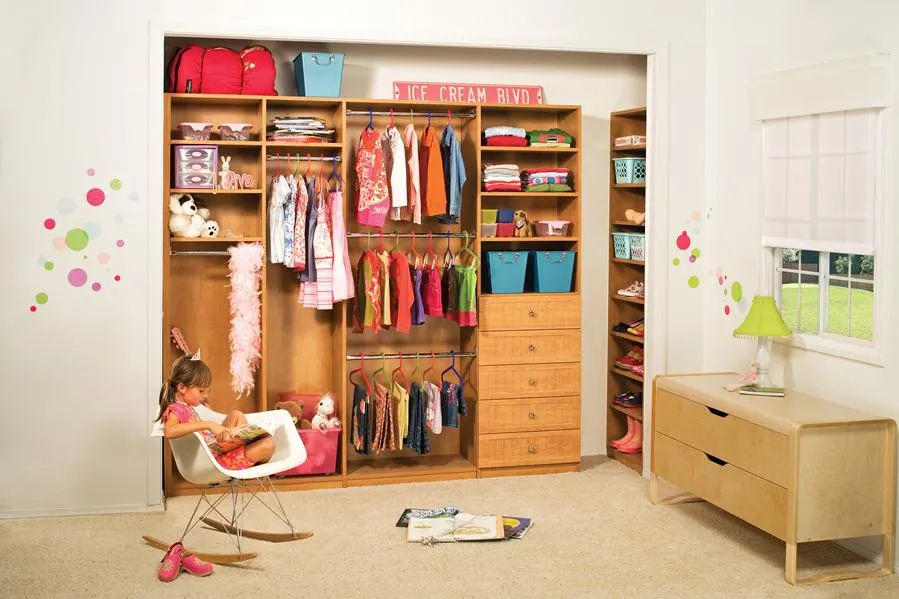 Picture of In a well-organized closet space, a young girl reads in her chair, embodying comfort and tranquility. PremierGarage creates these serene environments, consistently achieving a Highest in Quality rating. Copyright ©2025 Diamond Certified Resource - PremierGarage