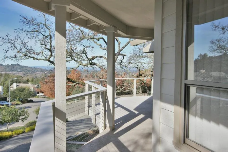 Picture of  Sunlight casts shadows on a meticulously crafted balcony, highlighting the serene view of the landscape beyond. Gold Hammer Construction, Inc. has achieved high customer satisfaction ratings through attention to detail and quality craftsmanship. Copyright ©2025 Diamond Certified Resource.

 - Gold Hammer Construction, Inc.