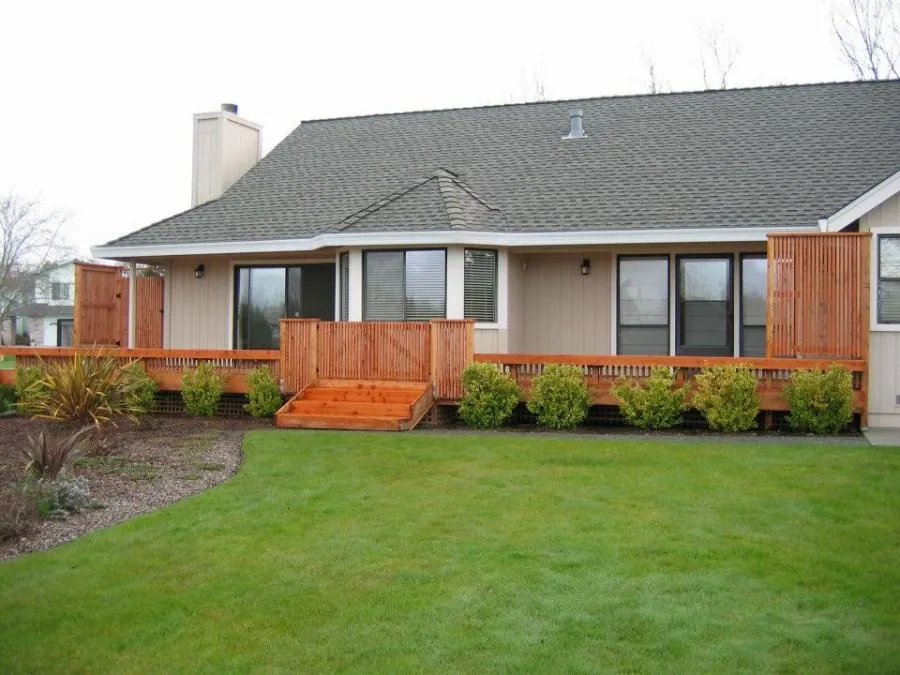 Picture of  A beautifully crafted wooden deck seamlessly extends from the house, embodying Gold Hammer Construction, Inc.'s focus on quality outcomes. The new design enhances the home's charm with elegance. Copyright ©2025 Diamond Certified Resource.

 - Gold Hammer Construction, Inc.