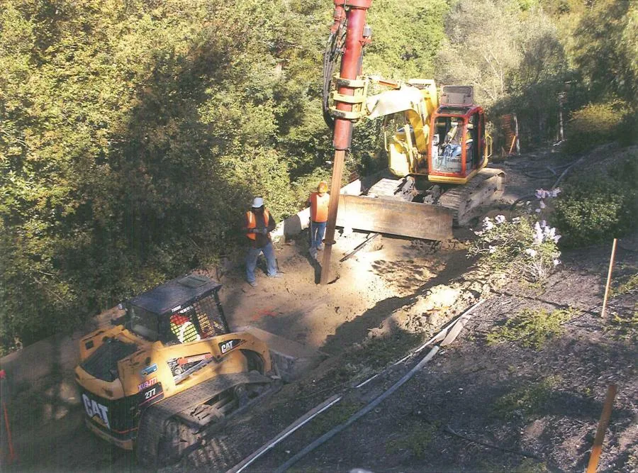 Picture of  In a serene forest setting, Engineered Soil Repairs, Inc. expertly maneuvers heavy machinery for precision foundation work. Recognized for expertise and quality, the company ensures stability and safety. Copyright ©2025 Diamond Certified Resource.

 - Engineered Soil Repairs, Inc.