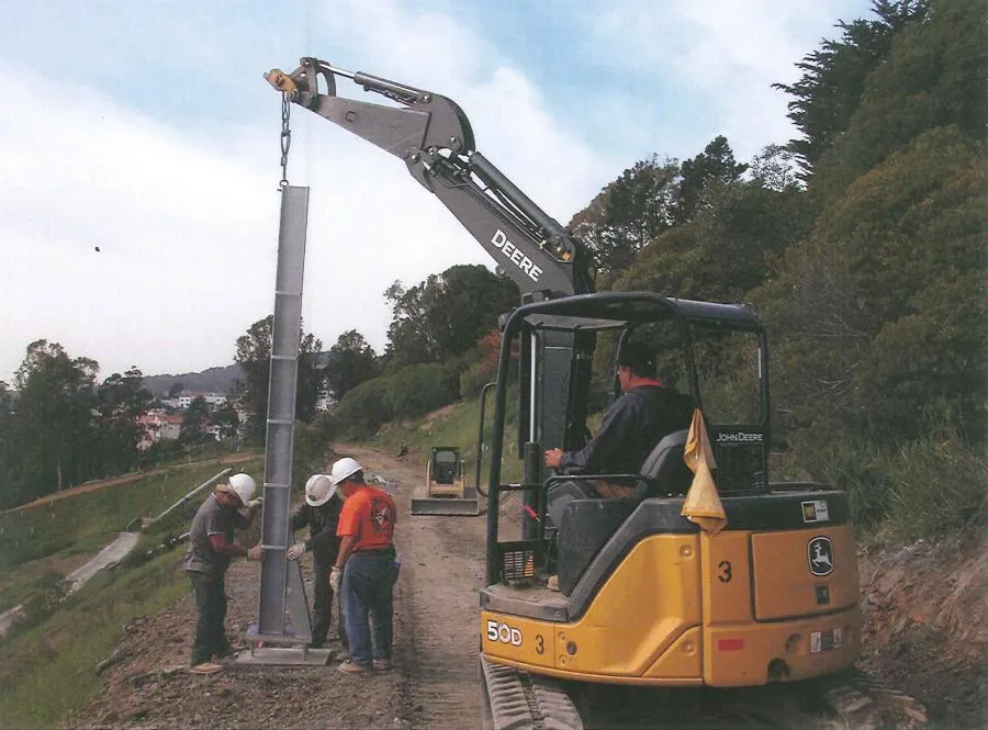 Picture of Along a rugged hillside, a team expertly maneuvers a towering steel beam into place, showcasing Engineered Soil Repairs, Inc.'s commitment to quality outcomes. This moment exemplifies their recognition for expertise and quality. Copyright ©2025 Diamond Certified Resource. - Engineered Soil Repairs, Inc.