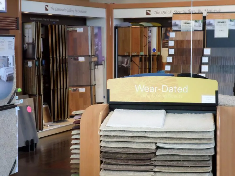 Picture of In the showroom of The Floor Store, a neatly stacked array of carpet samples invites touch, each piece promising durability and elegance. The companyâ€™s focus on quality outcomes is evident in every detail. Copyright ©2025 Diamond Certified Resource

 - The Floor Store