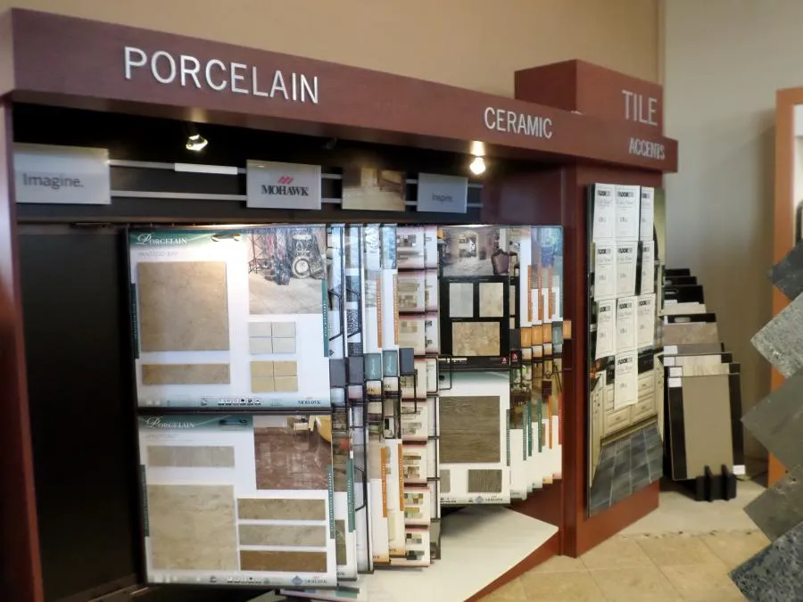 Picture of In the heart of The Floor Store, a display of porcelain and ceramic tile samples invites customers to explore design possibilities. The company's focus on quality outcomes is evident in every detail. Copyright ©2025 Diamond Certified Resource

 - The Floor Store