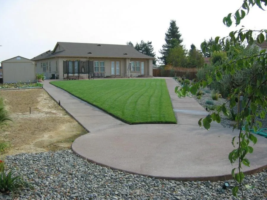 Picture of A pristine backyard showcases Gold Hammer Construction, Inc.'s commitment to quality outcomes, with a seamlessly integrated lawn and patio design. The tranquil setting highlights their expertise in creating harmonious outdoor spaces. Copyright ©2025 Diamond Certified Resource. - Gold Hammer Construction, Inc.