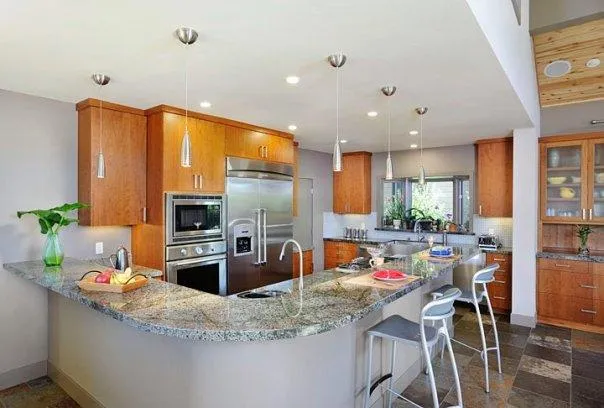Picture of In this modern kitchen, sleek granite countertops and polished wood cabinetry reflect Bell Products, Inc.'s commitment to quality outcomes. This inviting space hints at the artistry behind everyday living. Copyright ©2025 Diamond Certified Resource. - Bell Products, Inc.