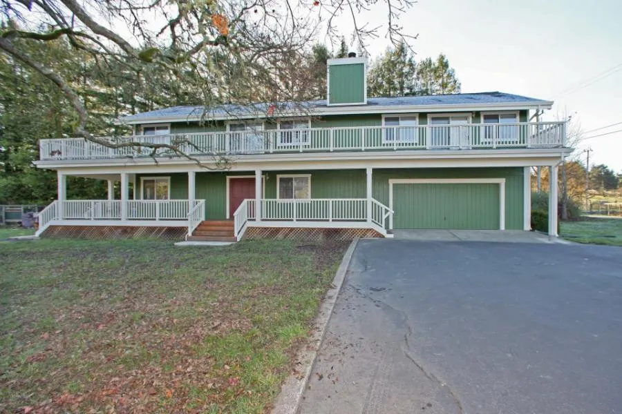 Picture of  A newly remodeled two-story house stands surrounded by serene nature, showcasing Gold Hammer Construction, Inc.'s commitment to quality outcomes. Consistently achieving the Highest in Quality rating, this project illustrates their dedication to excellence. Copyright ©2025 Diamond Certified Resource.

 - Gold Hammer Construction, Inc.