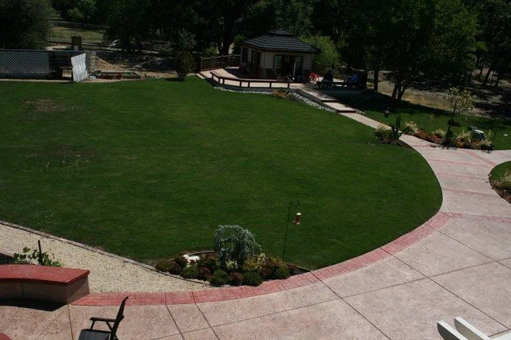 Picture of An impeccably maintained lawn and pathway lead to a cozy garden house, showcasing Quality First Home Improvement, Inc.'s dedication to quality outcomes. Recognized for expertise and quality, the company transforms outdoor spaces into serene retreats. Copyright ©2025 Diamond Certified Resource. - Quality First Home Improvement, Inc.