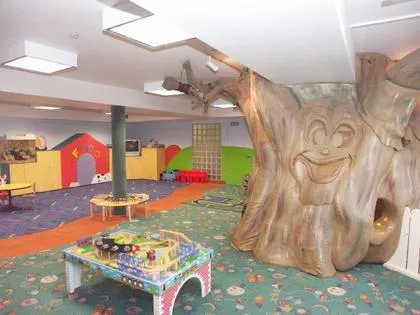 Picture of In the heart of Prime Time Athletic Clubâ€™s vibrant play area, a whimsical tree sculpture invites young imaginations to explore and play, embodying the clubâ€™s focus on quality outcomes. Copyright ©2025 Diamond Certified Resource - Prime Time Athletic Club