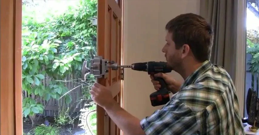 Picture of A skilled technician from First Lock & Security Technologies expertly installs a lock on a wooden door, demonstrating the companyâ€™s dedication to quality outcomes. Recognized for expertise and quality, the technician ensures secure and precise fitting. Copyright ©2025 Diamond Certified Resource

 - First Lock & Security Technologies