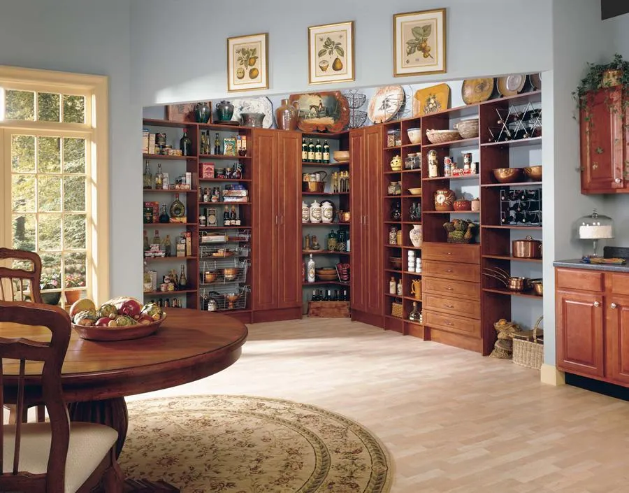 Picture of Sunlight filters through a large window, illuminating an elegantly organized pantry filled with spices and cookware, a testament to PremierGarage's focus on quality outcomes. Their custom storage solutions blend seamlessly with the room's warm aesthetic, ensuring both beauty and functionality. Copyright ©2025 Diamond Certified Resource - PremierGarage