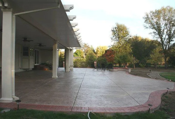 Picture of  A spacious, meticulously crafted patio extends under a sleek awning, inviting relaxation and gatherings. Quality First Home Improvement, Inc. ensures quality outcomes through expert design and construction. Copyright ©2025 Diamond Certified Resource.

 - Quality First Home Improvement, Inc.