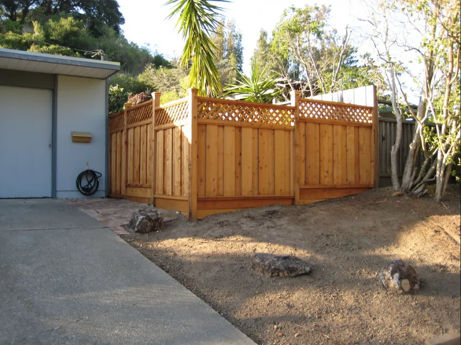 Picture of A newly installed wooden fence graces a tidy backyard corner, reflecting California Fencing's commitment to quality outcomes. The design complements the natural surroundings, highlighting the companyâ€™s dedication to high customer satisfaction ratings. Copyright ©2025 Diamond Certified Resource

 - California Fencing