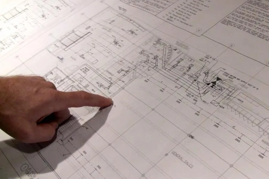 Picture of  A hand carefully traces technical drawings, reflecting Schmitt Heating Company, Inc.'s dedication to precision in their projects. Renowned for focusing on quality outcomes, their expertise shines through meticulous planning. Copyright ©2025 Diamond Certified Resource.

 - Schmitt Heating Company, Inc.