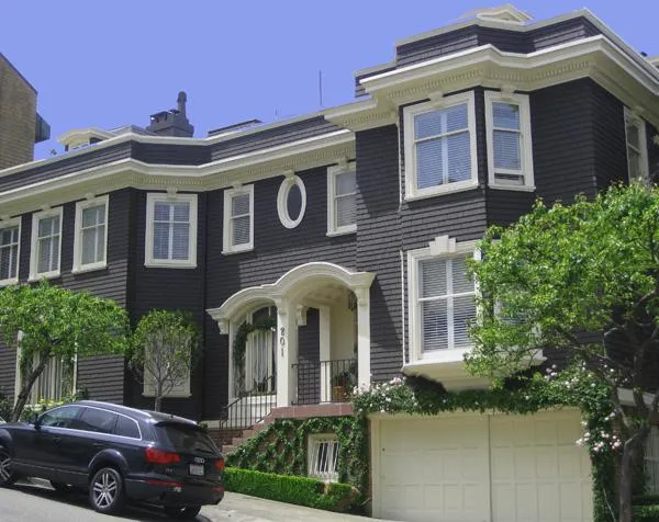 Picture of  A meticulously painted dark blue townhouse showcases Tara Pro Painting, Inc.'s dedication to quality outcomes. Framed by lush greenery, the facade stands as a testament to their highest quality rating. Copyright ©2025 Diamond Certified Resource.

 - Tara Pro Painting, Inc.