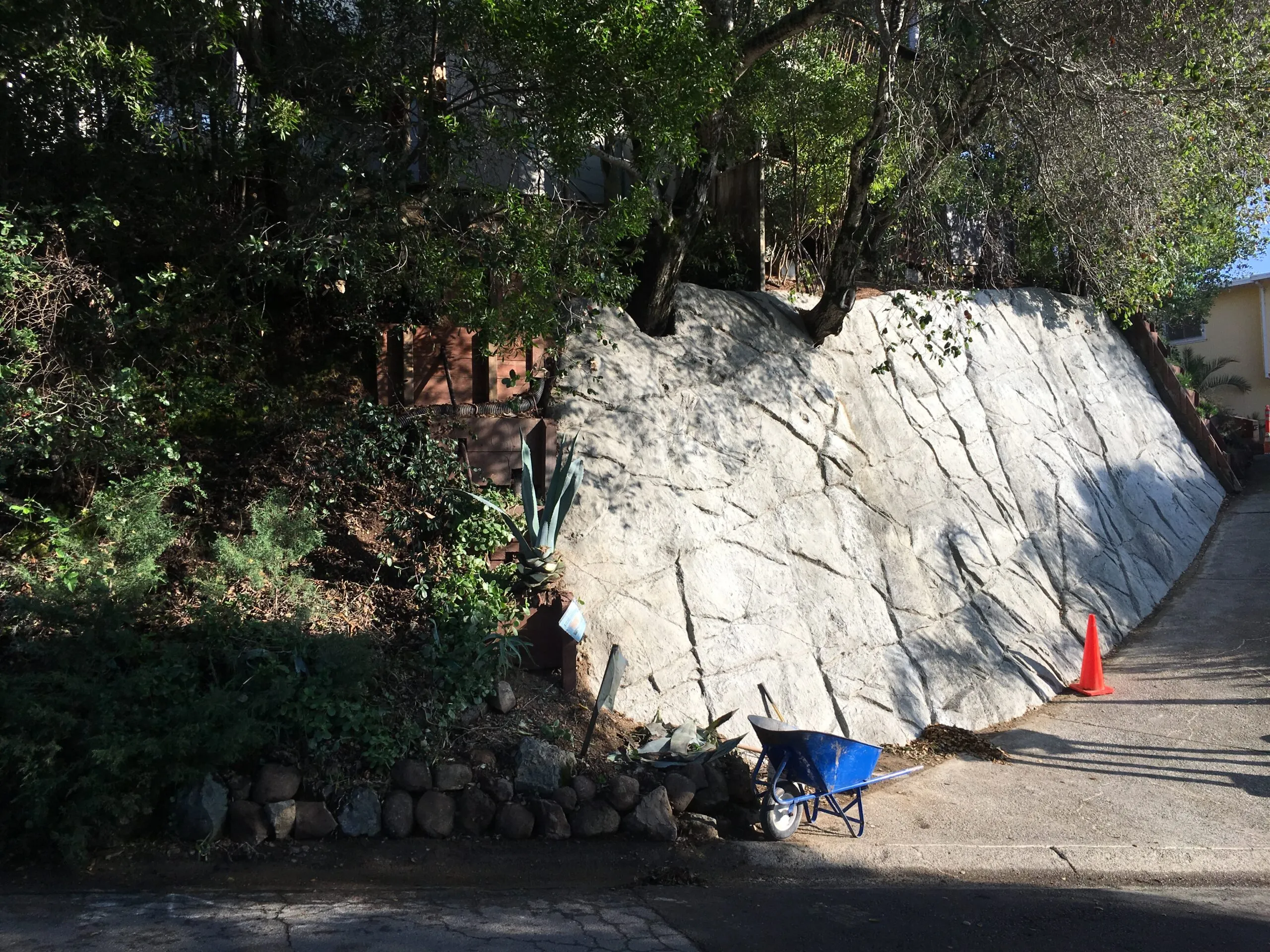 Picture of A sturdy retaining wall holds firm amidst lush greenery, a testament to AcuStruct's focus on quality outcomes. Their expertise in structural integrity is matched only by their commitment to high customer satisfaction. Copyright ©2025 Diamond Certified Resource - AcuStruct