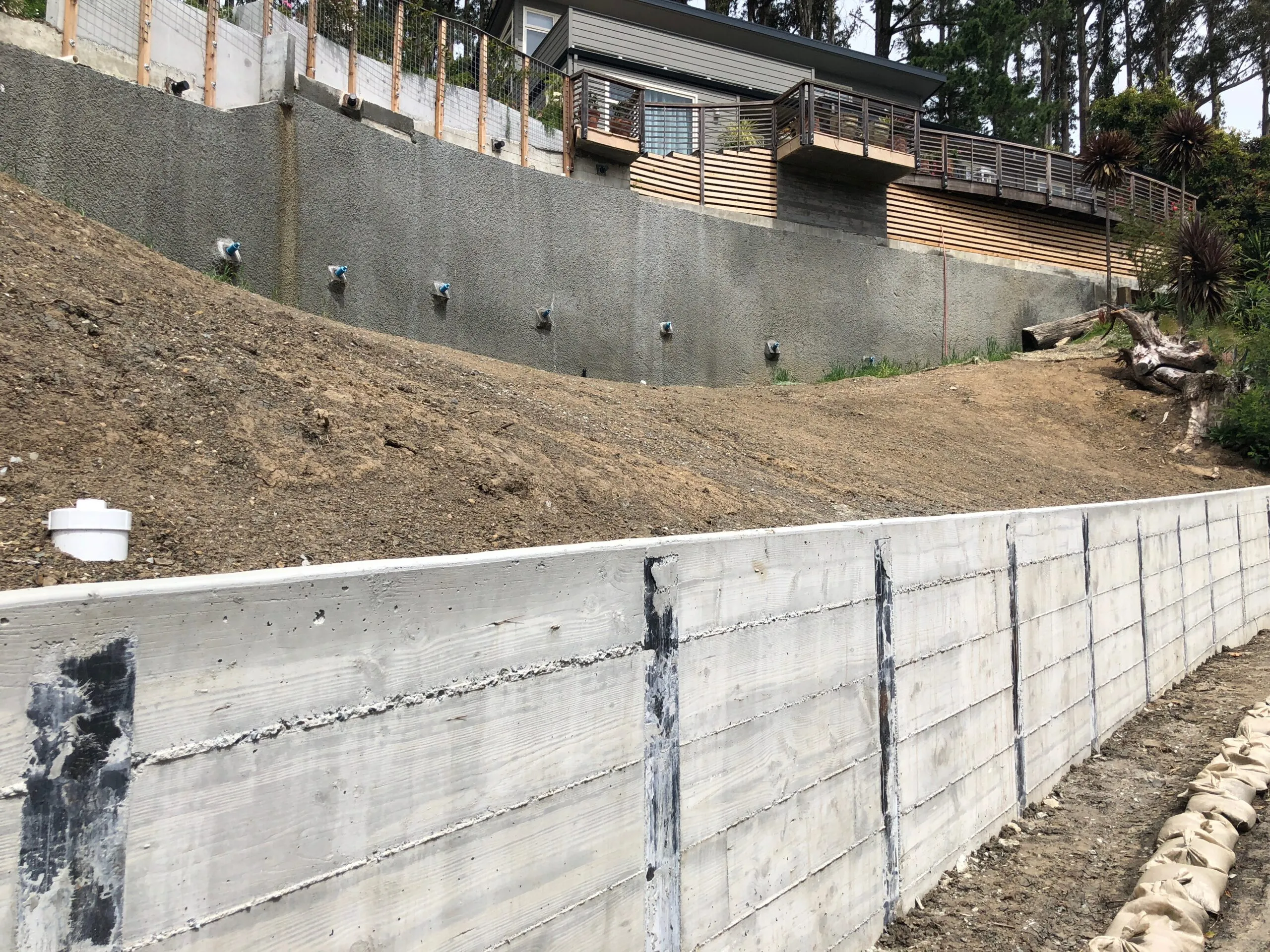 Picture of AcuStruct reinforces hillside stability with precision-crafted retaining walls, showcasing their commitment to quality outcomes that earned them a Diamond Certified status. Copyright ©2025 Diamond Certified Resource - AcuStruct