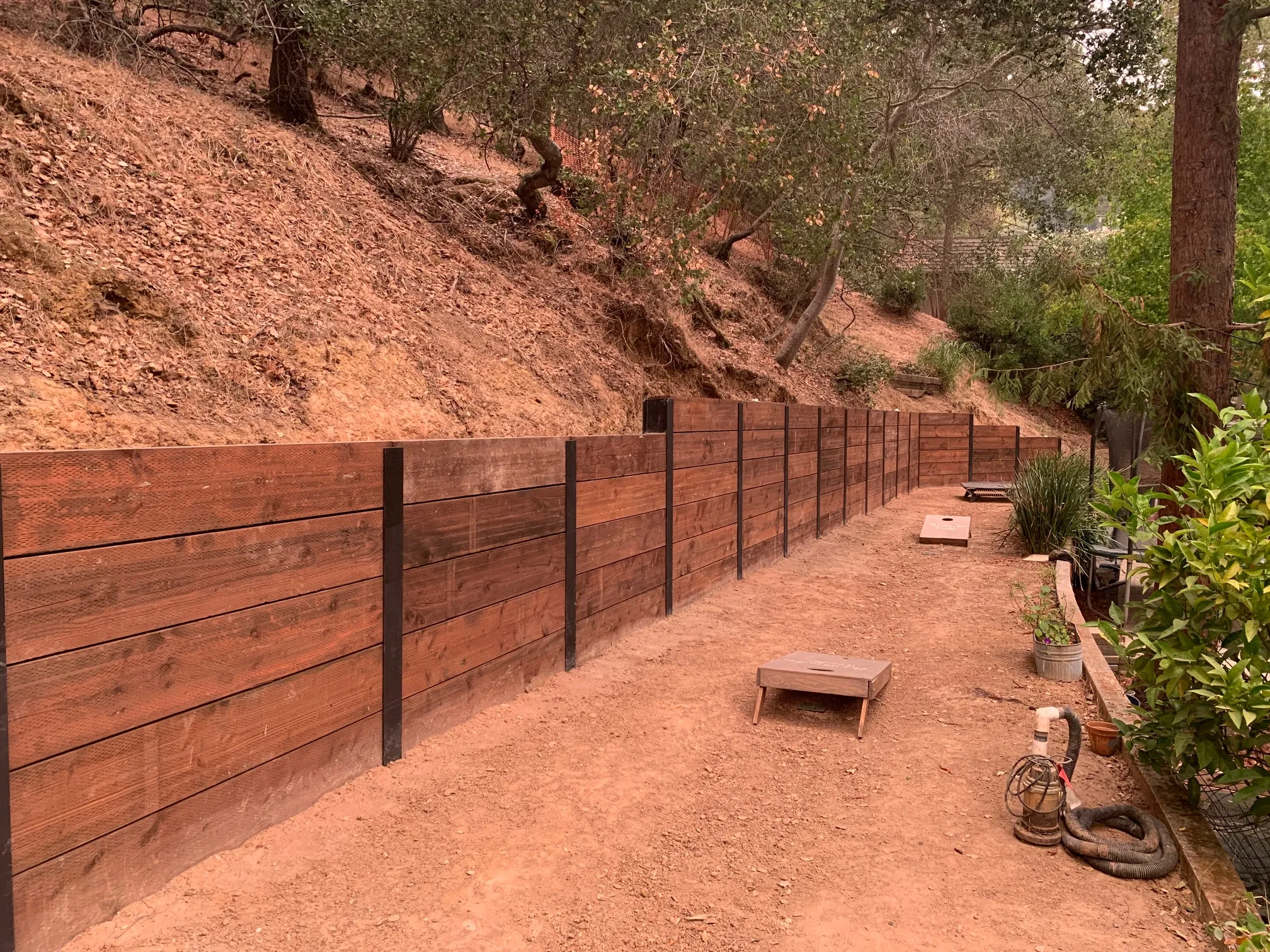 Picture of In the tranquility of a wooded hillside, AcuStruct's craftsmanship stands out with a newly installed retaining wall, reflecting their focus on quality outcomes. Recognized for earning Diamond Certified, AcuStruct delivers both aesthetic and structural excellence. Copyright ©2025 Diamond Certified Resource

 - AcuStruct