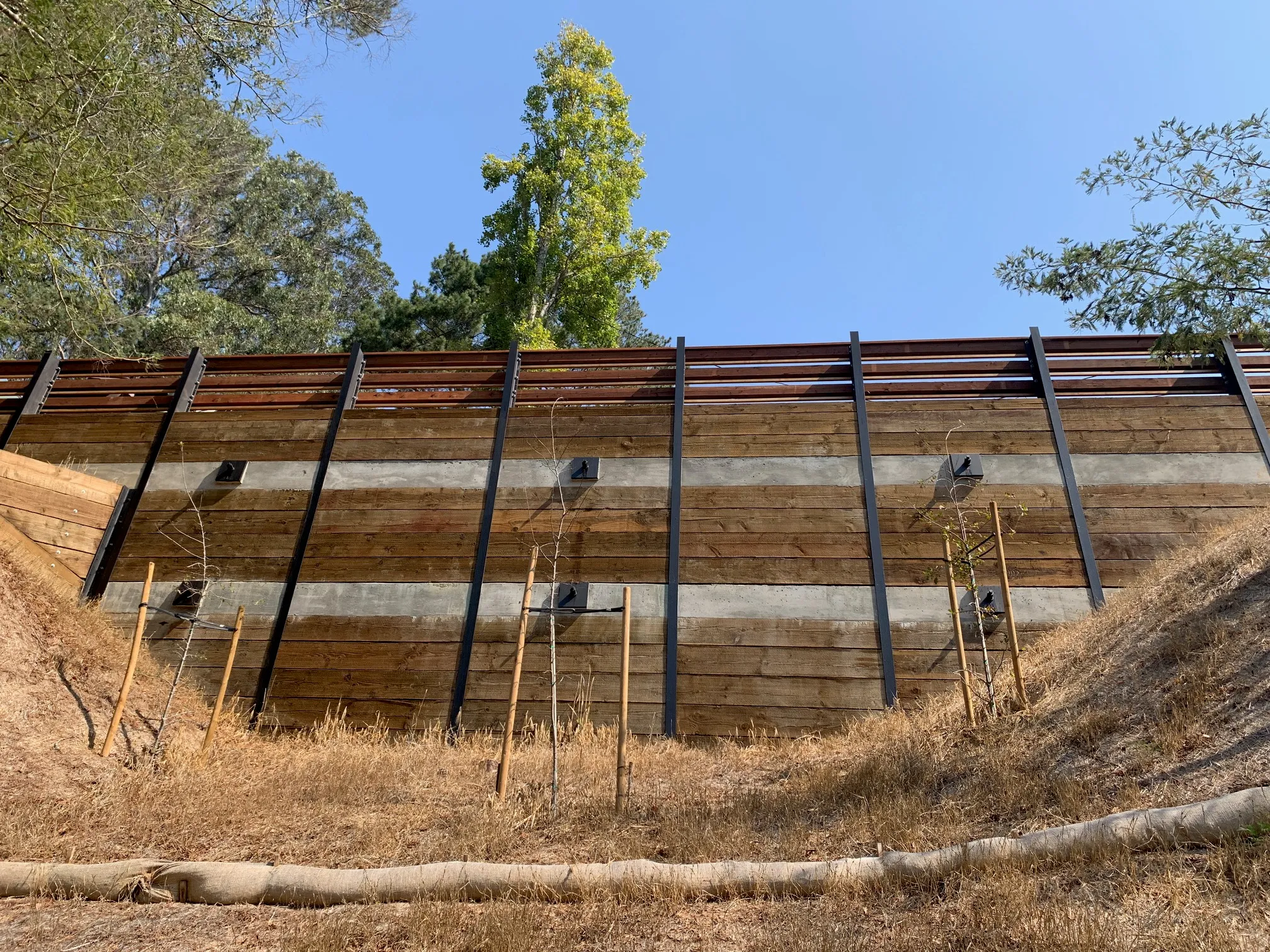 Picture of Amidst golden grasses, a sturdy retaining wall stands testament to AcuStruct's commitment to quality outcomes. This craftsmanship reflects the company's dedication to maintaining high customer satisfaction ratings. Copyright ©2025 Diamond Certified Resource

 - AcuStruct