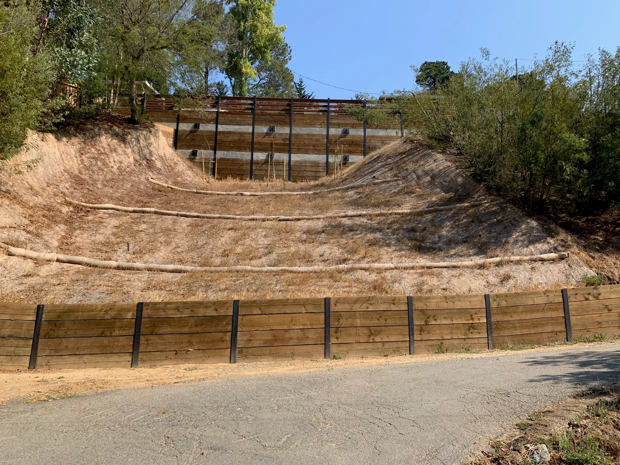 Picture of A recently reinforced hillside, stabilized by AcuStruct, stands as a testament to the companyâ€™s commitment to quality outcomes. The precise engineering and robust materials reflect AcuStruct's dedication to safety and excellence, consistently achieving the Highest in Quality rating. Copyright ©2025 Diamond Certified Resource

 - AcuStruct