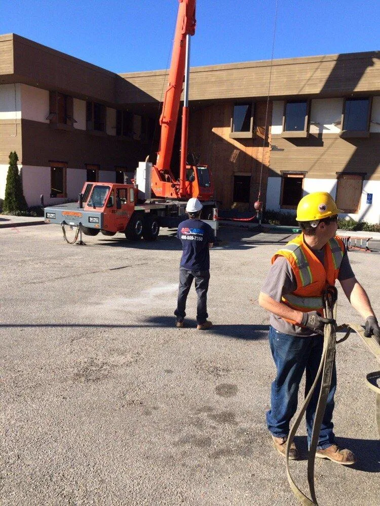 Picture of  Under a clear blue sky, a team prepares rigging for a lift outside an office building. This moment captures Air Care Heating & Cooling, Inc.'s focus on quality outcomes in every project they undertake. Copyright ©2025 Diamond Certified Resource.

 - Air Care Heating & Cooling, Inc.