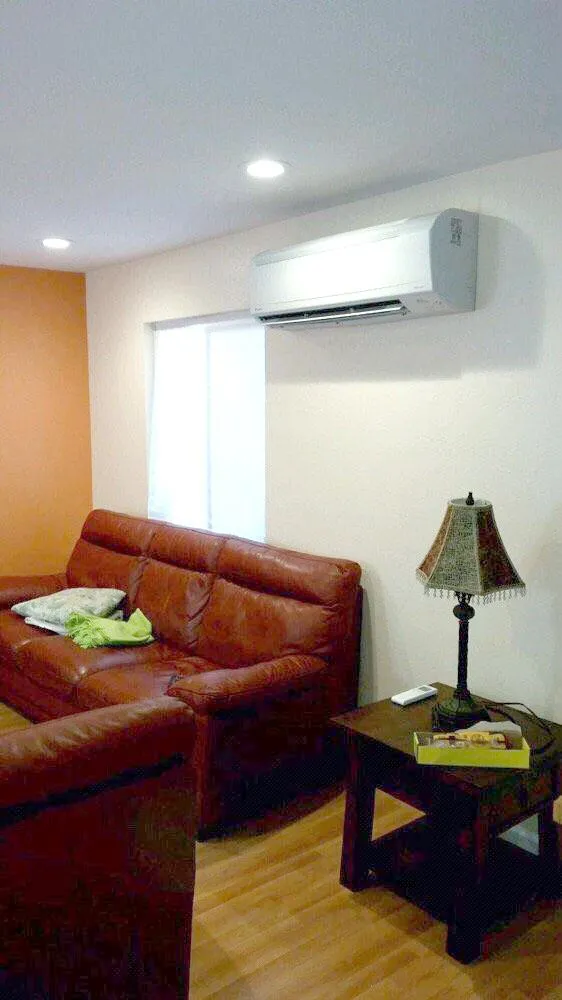 Picture of  A seamless blend of comfort and efficiency, this living room features an expertly installed air conditioning unit by Air Care Heating & Cooling, Inc. Known for high customer satisfaction ratings, the company ensures a perfect climate in style. Copyright ©2025 Diamond Certified Resource.

 - Air Care Heating & Cooling, Inc.