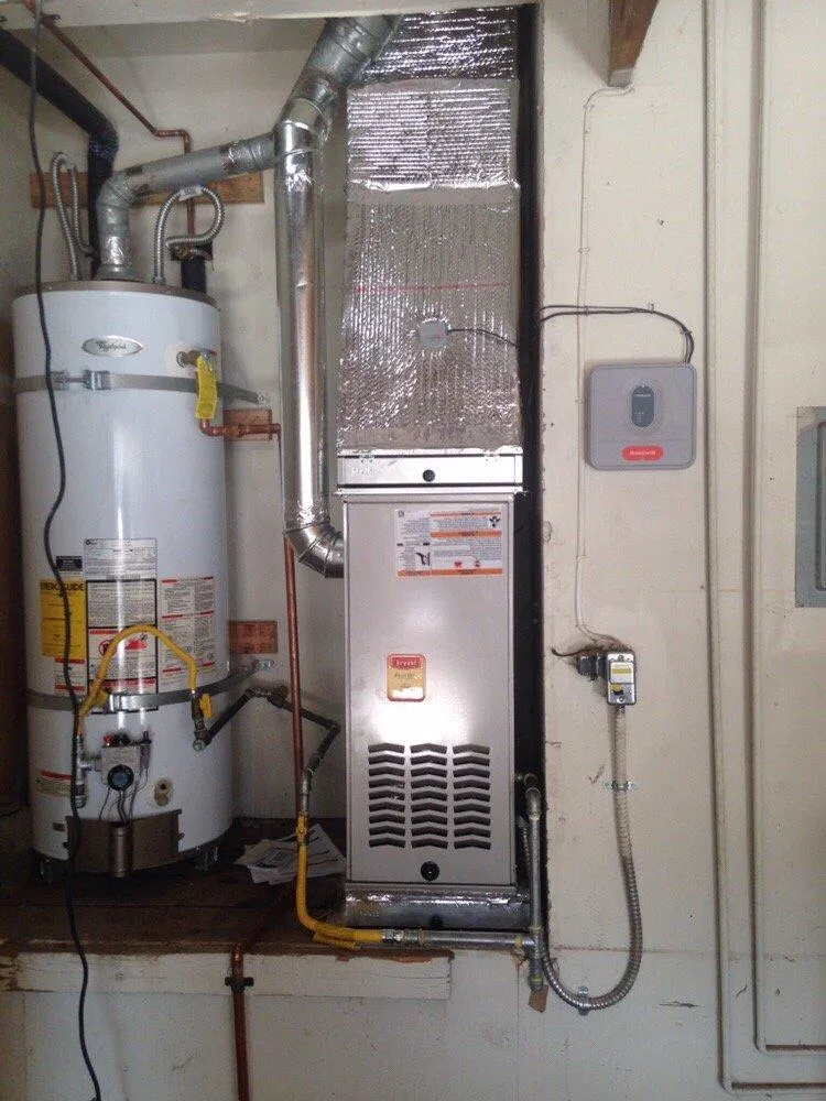 Picture of  A newly installed furnace and water heater system reflects Air Care Heating & Cooling, Inc.'s commitment to quality and expertise. The precise installation highlights why the company earned Diamond Certified. Copyright ©2025 Diamond Certified Resource.

 - Air Care Heating & Cooling, Inc.