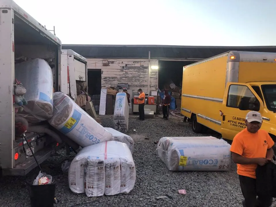 Picture of Workers from Attic Pros carefully unload eco-friendly insulation materials as part of their commitment to quality outcomes. Their focused expertise is evident in every detail. Copyright ©2025 Diamond Certified Resource

 - Attic Pros