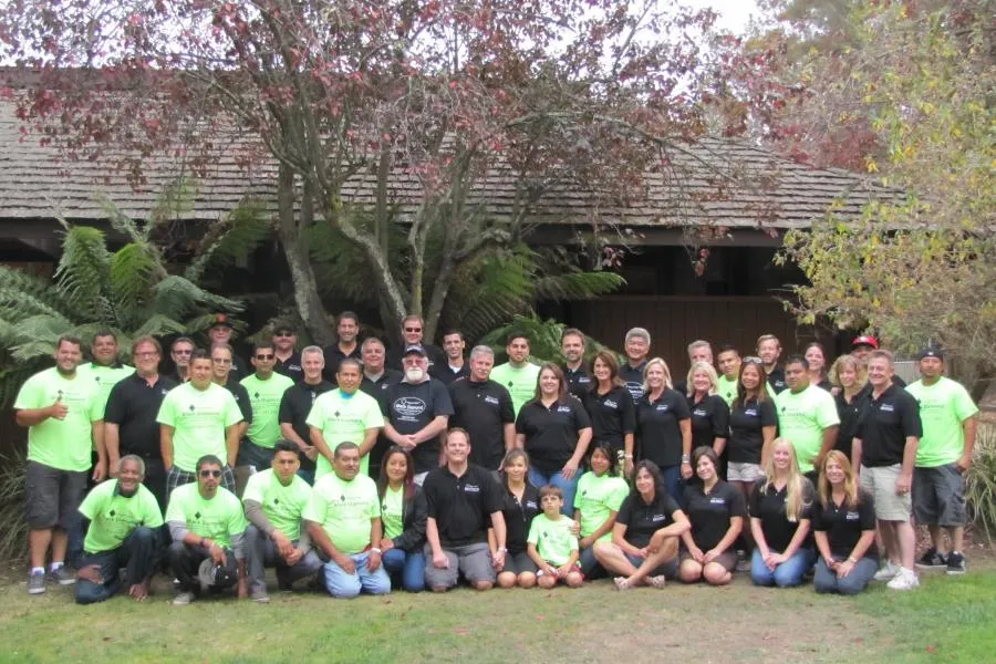 Picture of  A united team stands proudly outside a rustic building, reflecting the camaraderie and expertise at Black Diamond Paver Stones & Landscape, Inc. Recognized for expertise and quality, they embody a commitment to excellence. Copyright ©2025 Diamond Certified Resource.

 - Black Diamond Paver Stones & Landscape, Inc.