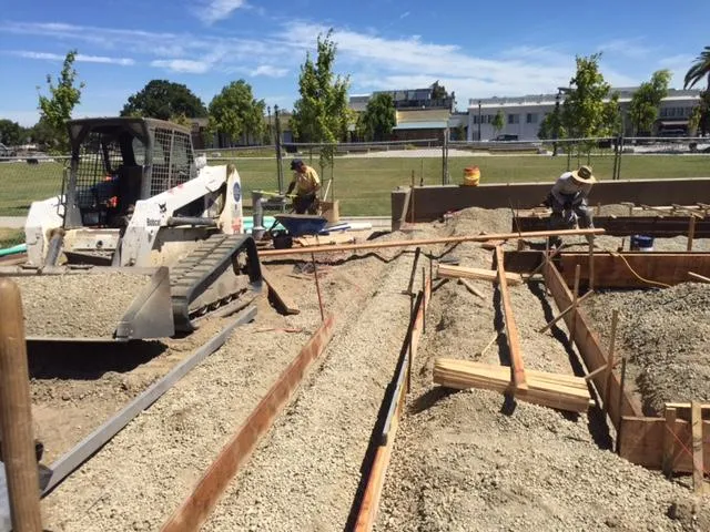 Picture of Amidst freshly laid gravel, Bay Area Drainage, Inc.'s expertise in quality outcomes shines through as workers focus on precision groundwork. The company consistently achieves a Highest in Quality rating. Copyright ©2025 Diamond Certified Resource. - Bay Area Drainage, Inc.