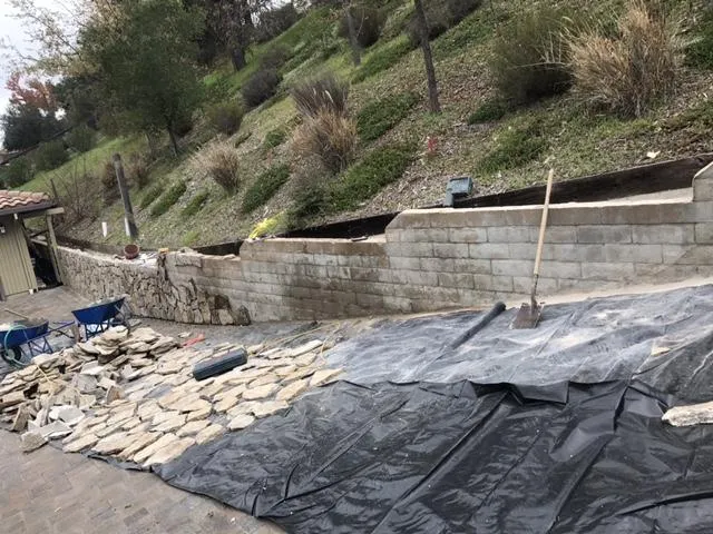 Picture of  A meticulous arrangement of stones lays the foundation for a robust retaining wall, echoing Bay Area Drainage, Inc.'s dedication to quality outcomes. Their expertise ensures each project is both functional and enduring. Copyright ©2025 Diamond Certified Resource.

 - Bay Area Drainage, Inc.