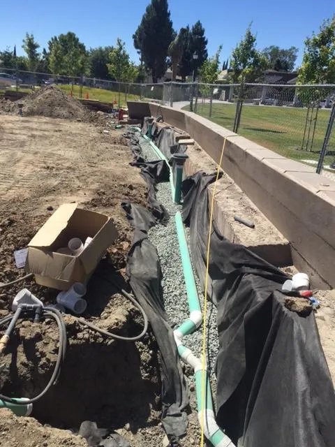 Picture of Amidst the methodical installation, Bay Area Drainage, Inc. exemplifies quality outcomes through precise placement of drainage pipes, ensuring optimal water management. Their commitment to excellence is reflected in their Diamond Certified status. Copyright ©2025 Diamond Certified Resource. - Bay Area Drainage, Inc.