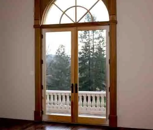 Picture of Sunlight pours through beautifully crafted wooden doors leading to a serene balcony, a testament to Steve Roberts Painting's focus on quality outcomes. The company, recognized for its expertise and quality, ensures every detail enhances a space's elegance. Copyright ©2025 Diamond Certified Resource

 - Steve Roberts Painting