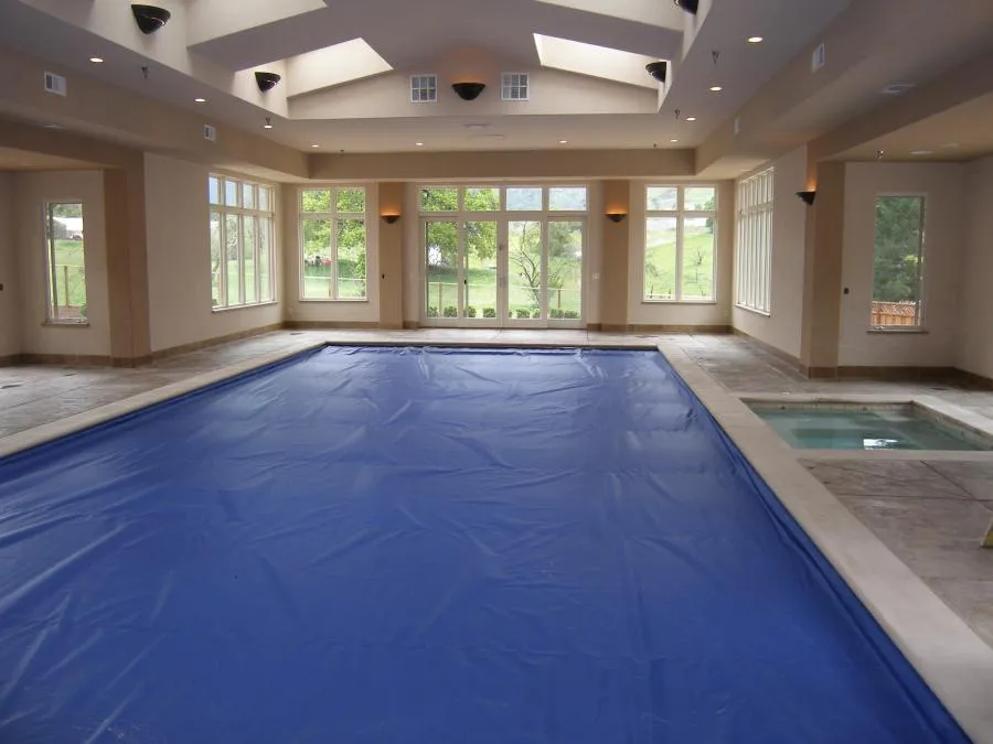 Picture of Within the tranquil setting of an indoor pool, Classic Pools showcases their dedication to quality with a sleek pool cover that hints at unparalleled craftsmanship. Their focus on quality outcomes is evident in every detail. Classic Pools consistently achieved a Highest in Quality rating. Copyright ©2025 Diamond Certified Resource

 - Classic Pools