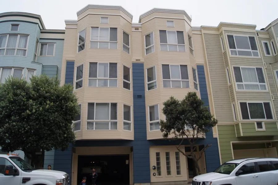 Picture of  A freshly painted apartment facade stands vibrant in its urban setting, showcasing Michael Sack Painting, Inc.'s commitment to quality outcomes. This attention to detail underscores their high customer satisfaction ratings. Copyright ©2025 Diamond Certified Resource.

 - Michael Sack Painting, Inc.