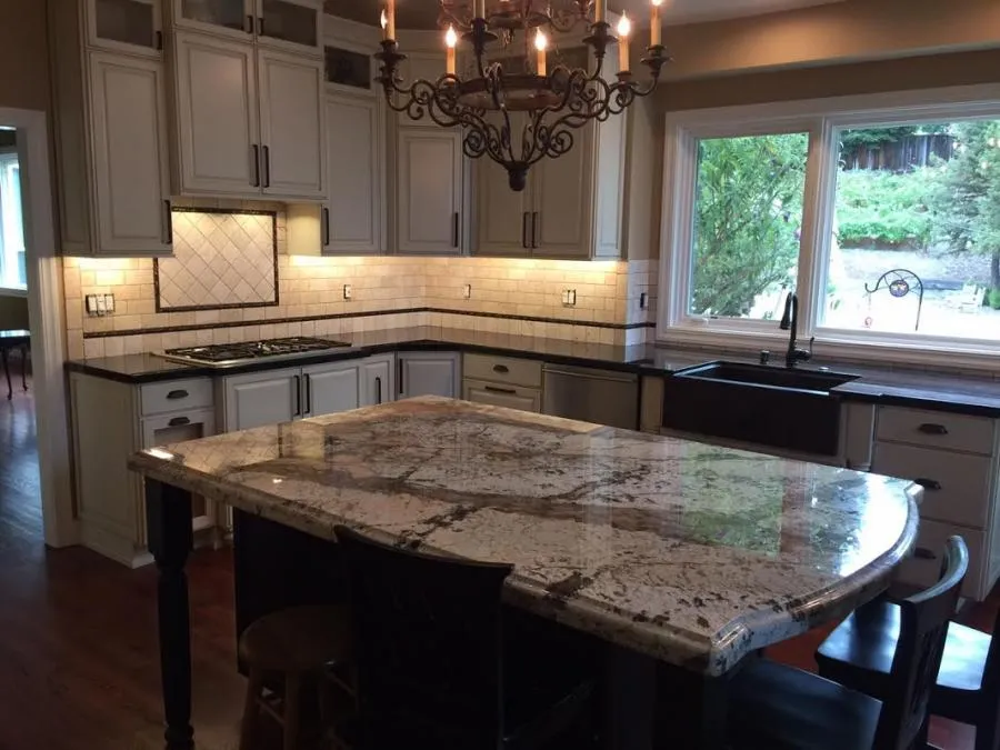 Picture of The elegant kitchen, featuring a granite countertop and ornate chandelier, exemplifies Cardinal Builder, Inc's dedication to quality outcomes. With a focus on high customer satisfaction, they transform spaces into refined beauty. Copyright ©2025 Diamond Certified Resource - Cardinal Builder, Inc