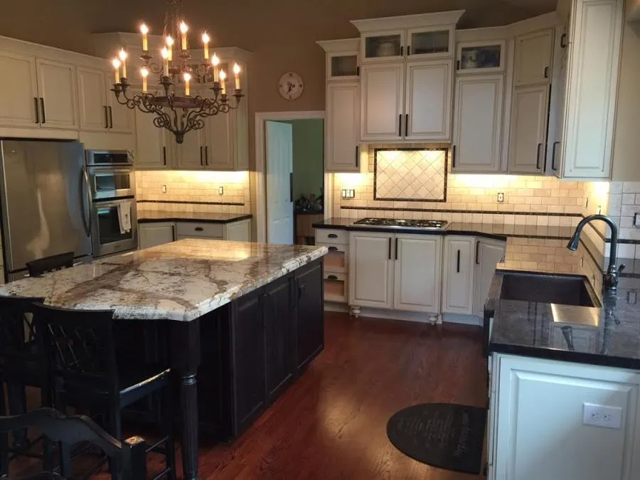 Picture of A newly remodeled kitchen gleams under a classic chandelier, showcasing Cardinal Builder, Inc's dedication to quality outcomes. This inviting space captures the essence of functional elegance, a testament to the company's high customer satisfaction ratings. Copyright ©2025 Diamond Certified Resource

 - Cardinal Builder, Inc