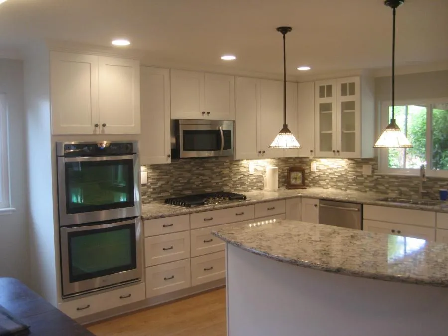 Picture of In this elegantly remodeled kitchen, Cardinal Builder, Inc showcases its commitment to quality outcomes with sleek cabinetry and modern appliances. Recognized for expertise and quality, the company crafts spaces that blend functionality with style. Copyright ©2025 Diamond Certified Resource - Cardinal Builder, Inc