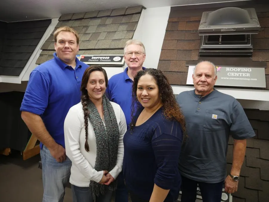 Picture of In a display of collaboration and expertise, Crandall Roofing Inc.â€™s dedicated team gathers in front of their roofing showcase, embodying the companyâ€™s focus on quality outcomes. Copyright ©2025 Diamond Certified Resource

 - Crandall Roofing Inc.