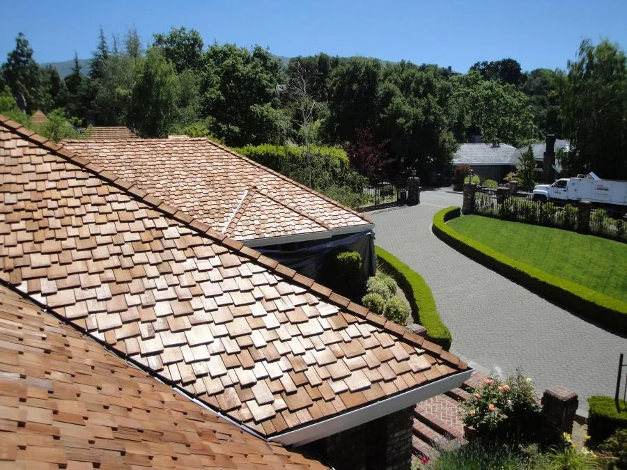 Picture of Sunlight gleams off the meticulously installed wooden shingles of a residential roof, showcasing Los Gatos Roofing's commitment to quality outcomes. Their craftsmanship is recognized for its expertise and quality. Copyright ©2025 Diamond Certified Resource

 - Los Gatos Roofing