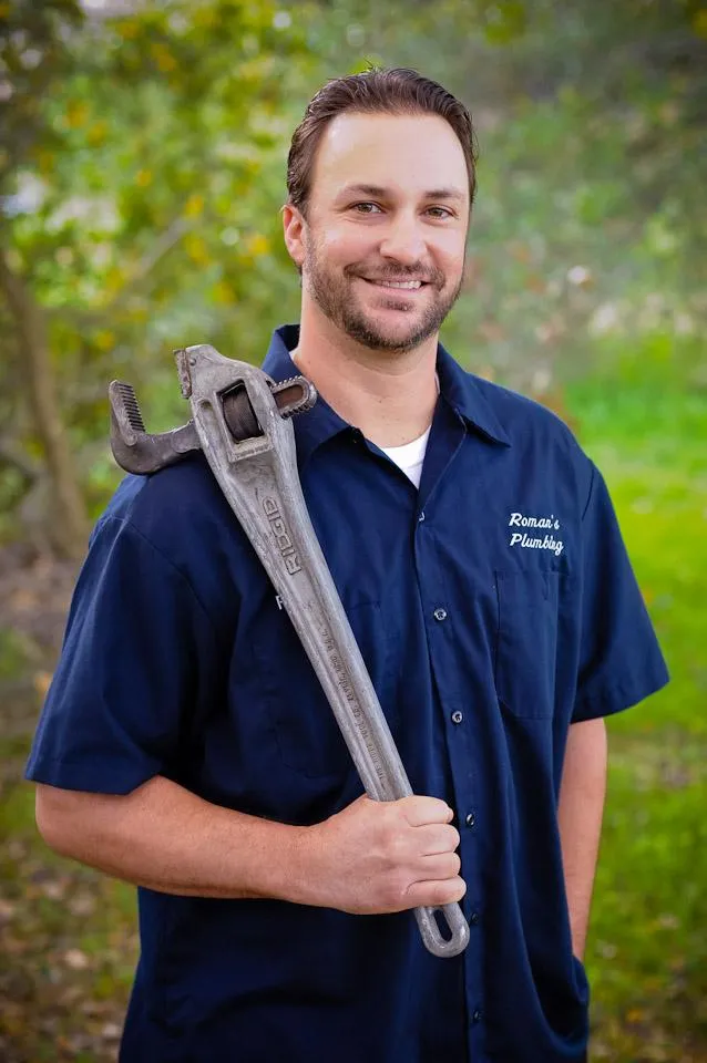 Picture of A professional from Roman's Plumbing, Inc. stands confidently with a wrench, embodying the company's focus on quality outcomes. Their expertise ensures high customer satisfaction. Copyright ©2025 Diamond Certified Resource. - Roman's Plumbing, Inc.