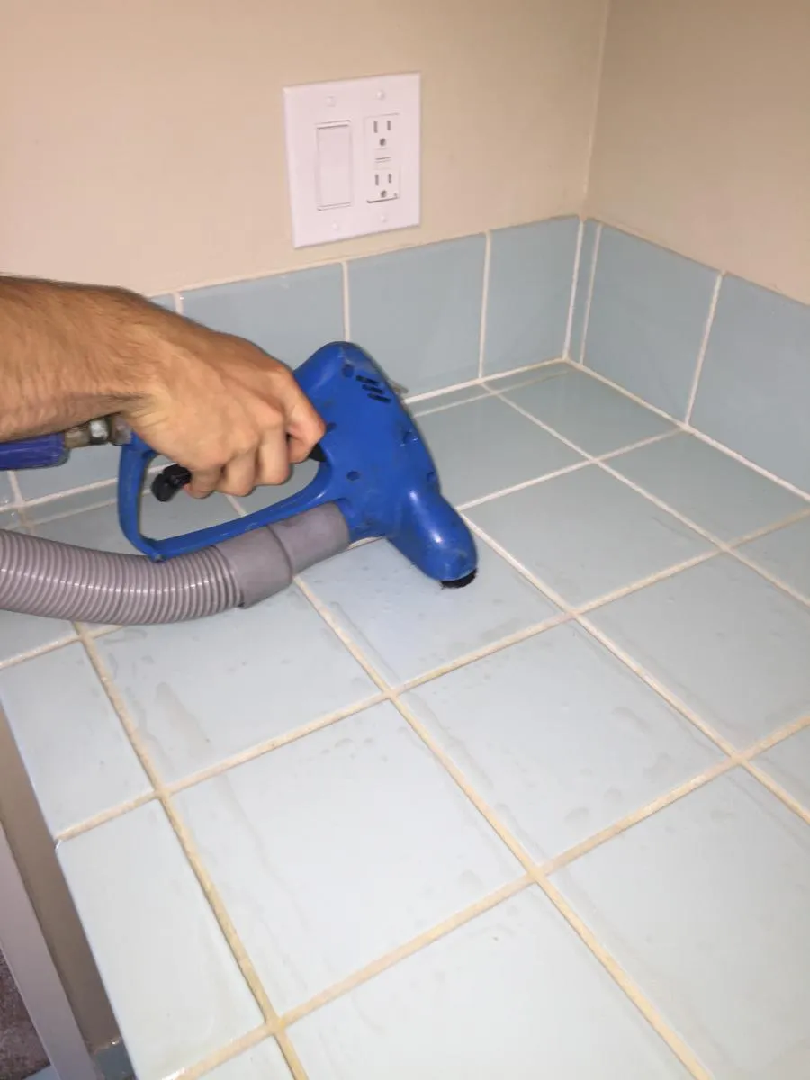Picture of A skilled hand guides a powerful cleaning tool across pristine tiles, showcasing Maximum Carpet Cleaning's commitment to quality outcomes. With a top-rated service in customer satisfaction, each task is executed with precision. Copyright ©2025 Diamond Certified Resource

 - Maximum Carpet Cleaning