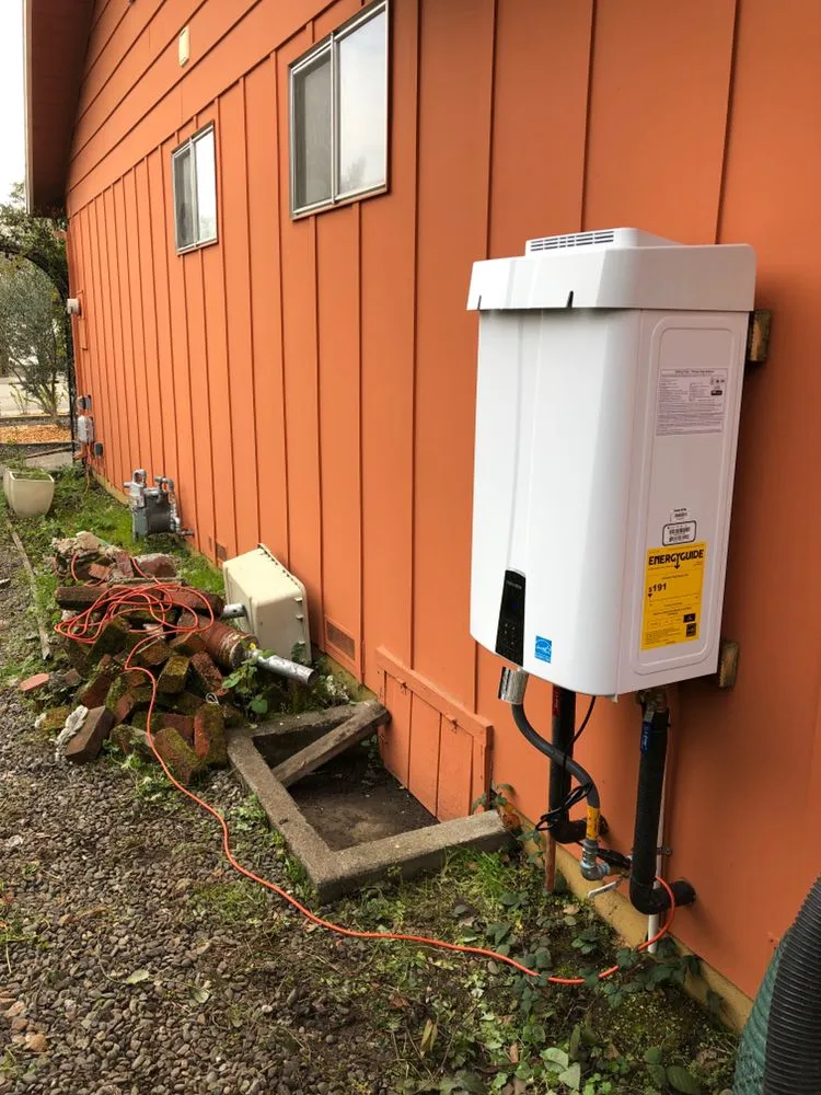 Picture of A newly installed tankless water heater sits neatly on the side of a vibrant orange wall, a testament to Elite Plumbing Services' dedication to quality outcomes. Their commitment to excellence is reflected in the high customer satisfaction ratings they consistently receive. Copyright ©2025 Diamond Certified Resource

 - Elite Plumbing Services