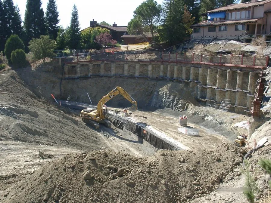Picture of  An excavator methodically digs into the earth, shaping a critical foundation as part of Engineered Soil Repairs, Inc.'s commitment to quality outcomes. This site exemplifies their top rated Quality in stabilizing landscapes for lasting safety and integrity. Copyright ©2025 Diamond Certified Resource.

 - Engineered Soil Repairs, Inc.