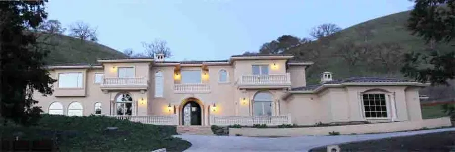 Picture of A grand residence sits serenely against rolling hills, showcasing the impeccable craftsmanship of Steve Roberts Painting. Recognized for expertise and quality, the company transforms homes into masterpieces. Copyright ©2025 Diamond Certified Resource - Steve Roberts Painting