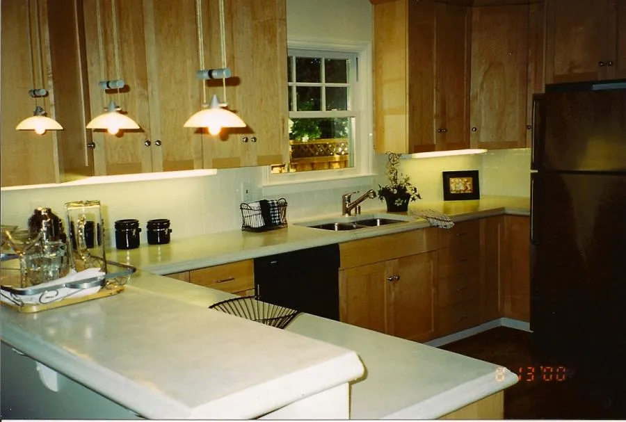 Picture of In this meticulously crafted kitchen by G. D. Enterprise, the understated elegance of wooden cabinetry and soft lighting reflects the companyâ€™s focus on quality outcomes, proven by high customer satisfaction ratings. Copyright ©2025 Diamond Certified Resource

 - G. D. Enterprise