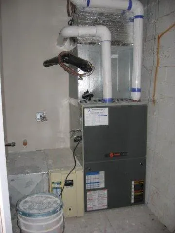 Picture of  Nestled in a compact utility room, a newly installed HVAC system by Innovative Mechanical, Inc. stands as a testament to the company's focus on quality outcomes. Precision in piping and attention to detail reflect their high customer satisfaction ratings. Copyright ©2025 Diamond Certified Resource.

 - Innovative Mechanical, Inc.