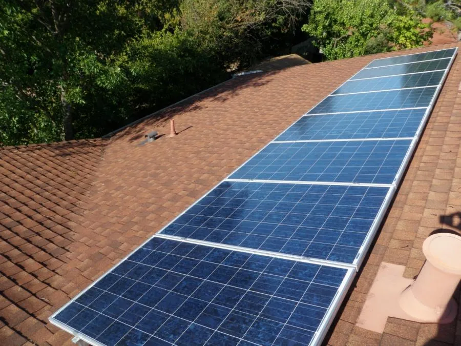 Picture of A row of solar panels gleams under the sun on a neatly shingled roof, capturing the essence of renewable energy. High Definition Solar's focus on quality outcomes is evident here, contributing to their high customer satisfaction ratings. Copyright ©2025 Diamond Certified Resource

 - High Definition Solar