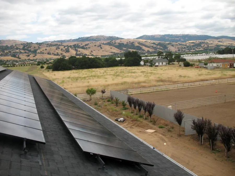 Picture of  Solar panels align a rooftop against a backdrop of serene hills, showcasing All Seasons Roofing & Waterproofing, Inc.'s commitment to quality outcomes. This landscape embodies the company’s top-rated expertise. Copyright ©2025 Diamond Certified Resource.

 - All Seasons Roofing & Waterproofing, Inc.