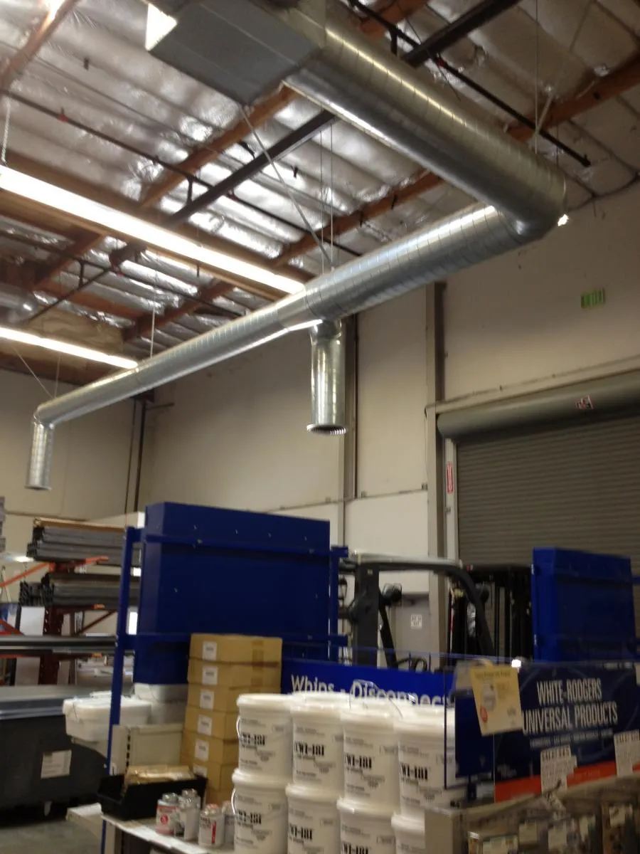 Picture of In this industrial setting, the precision of Qualtech Heating & Cooling's HVAC installation reflects their commitment to quality outcomes. The neatly arranged ducts signify the company's technical proficiency and earned Diamond Certified status. Copyright ©2025 Diamond Certified Resource - Qualtech Heating & Cooling