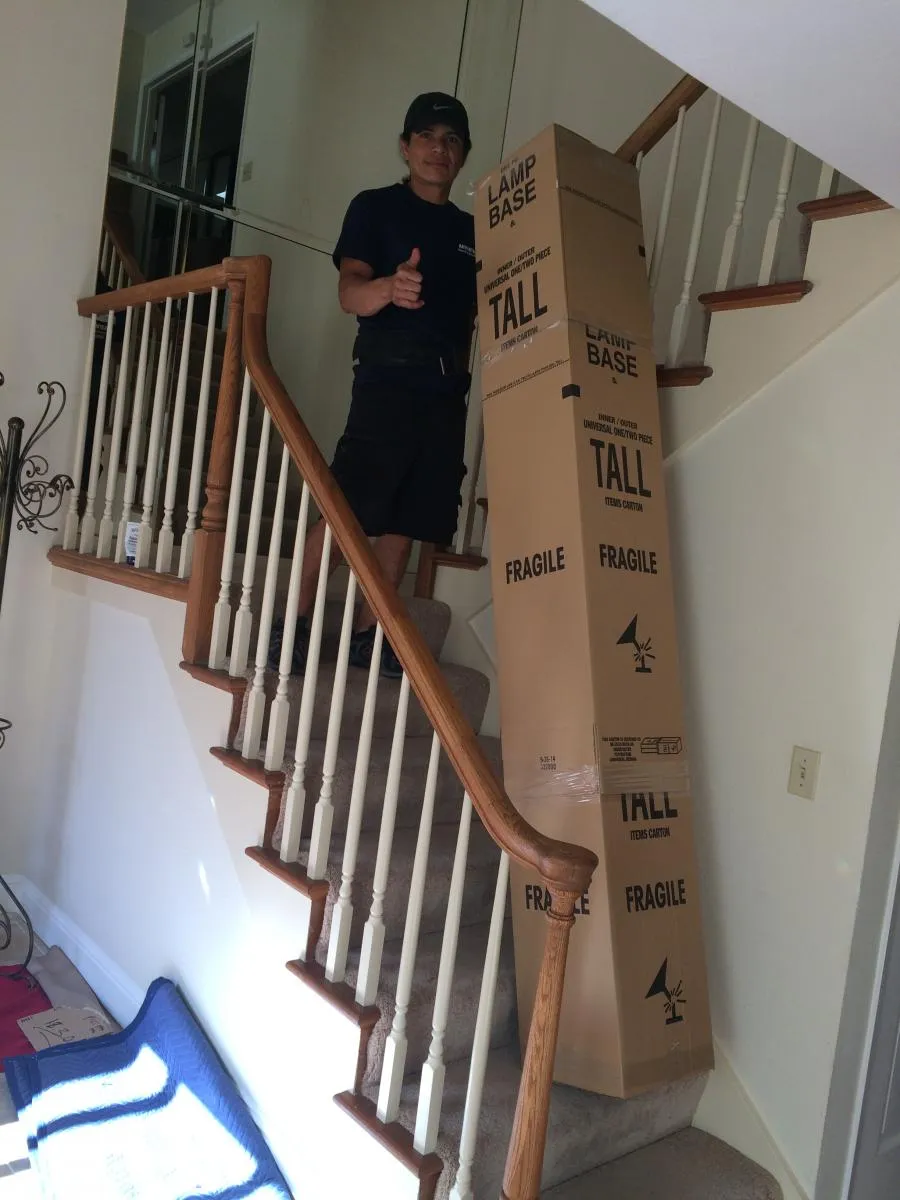 Picture of  A dedicated mover from Advantage Moving & Storage skillfully navigates a staircase, balancing a stack of fragile boxes with precision. The company's focus on quality outcomes shines through in each careful step. Copyright ©2025 Diamond Certified Resource.

 - Advantage Moving & Storage